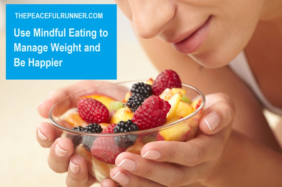 Young woman with a fresh bowl of healthy colourful fruit